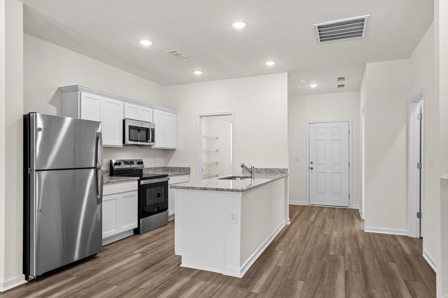 Representative furnished interior of a home built from the Highland by Starlight Homes in Sutton Farms, San Antonio (Image 8).