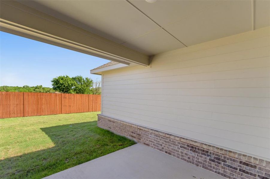 Exterior details and patio area of a home in Covenant Park, Springtown (Image 21).