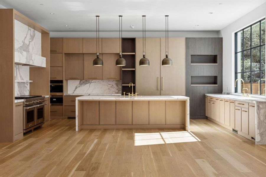 Kitchen with Wood Mode cabinetry and Calcutta Marble