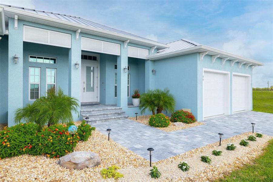Front exterior of a new home in , Placida, FL, highlighting curb appeal (Image 1).