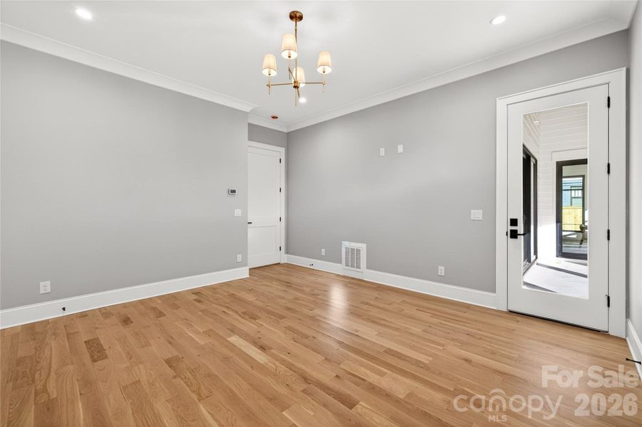 Bedroom on Main Level. Door leads to Rear Porch.