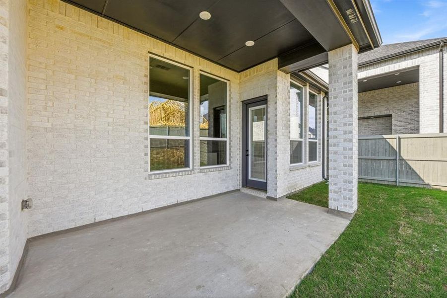 Exterior details and patio area of a home in Pecan Square, Northlake (Image 2).