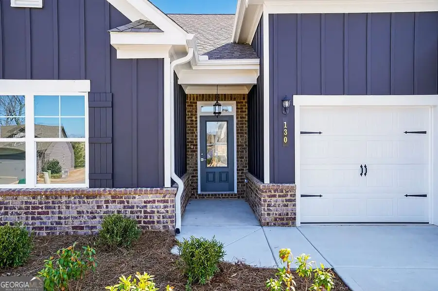 Exterior details and patio area of a home in Stone Brooke, Gray (Image 3).