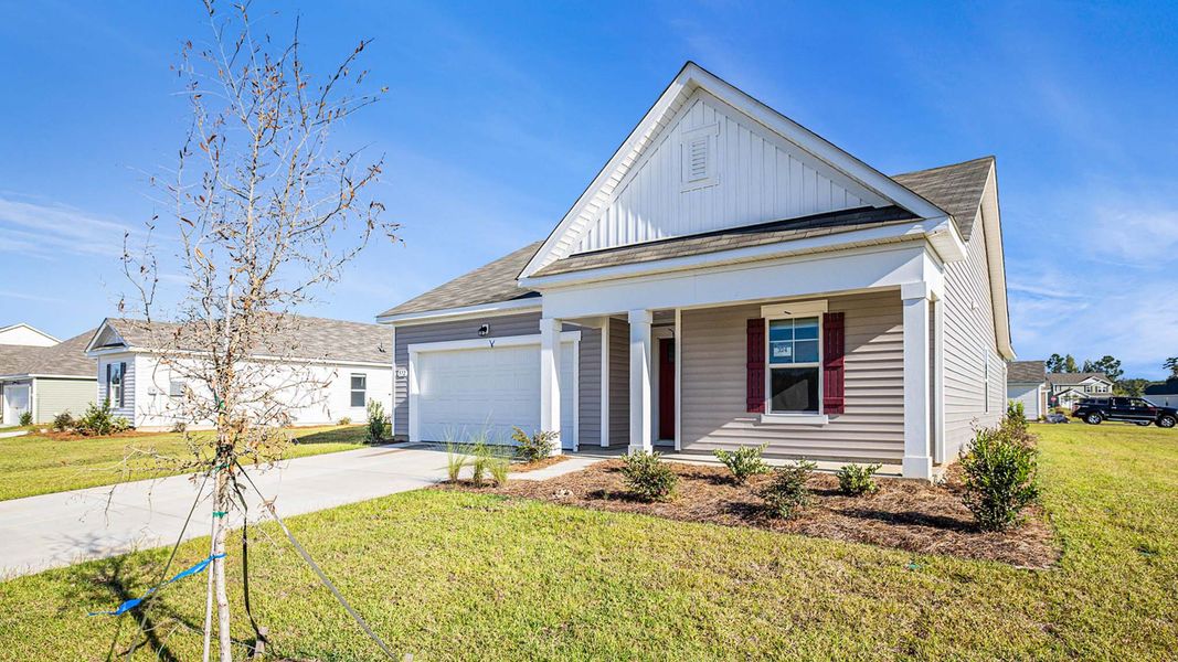 Front exterior of a new home in Harper Meadows, Loris, SC, highlighting curb appeal (Image 21). Front exterior of a new home in Harper Meadows, Loris, SC, highlighting curb appeal (Image 21).