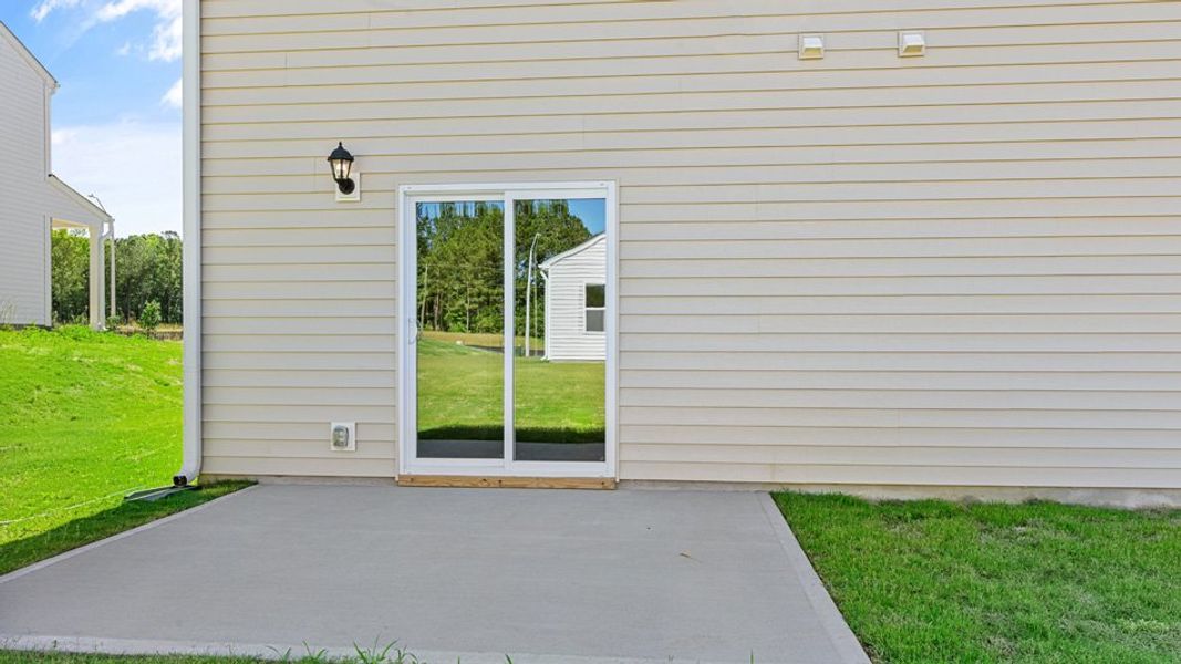 Exterior details and patio area of a home in East Ridge, Ayden (Image 4).