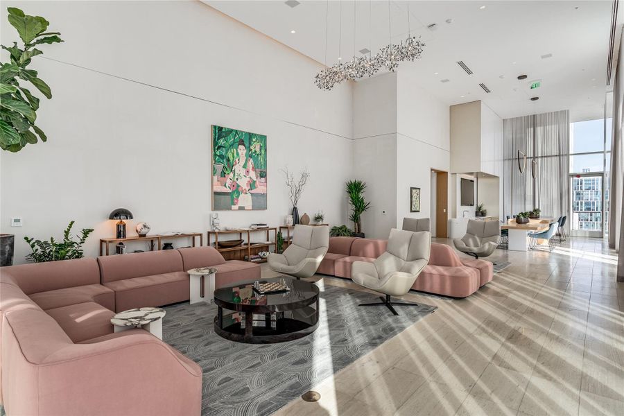A grand, naturally illuminated living room offers soaring ceilings and access to outdoor vistas. A grand, naturally illuminated living room offers soaring ceilings and access to outdoor vistas.