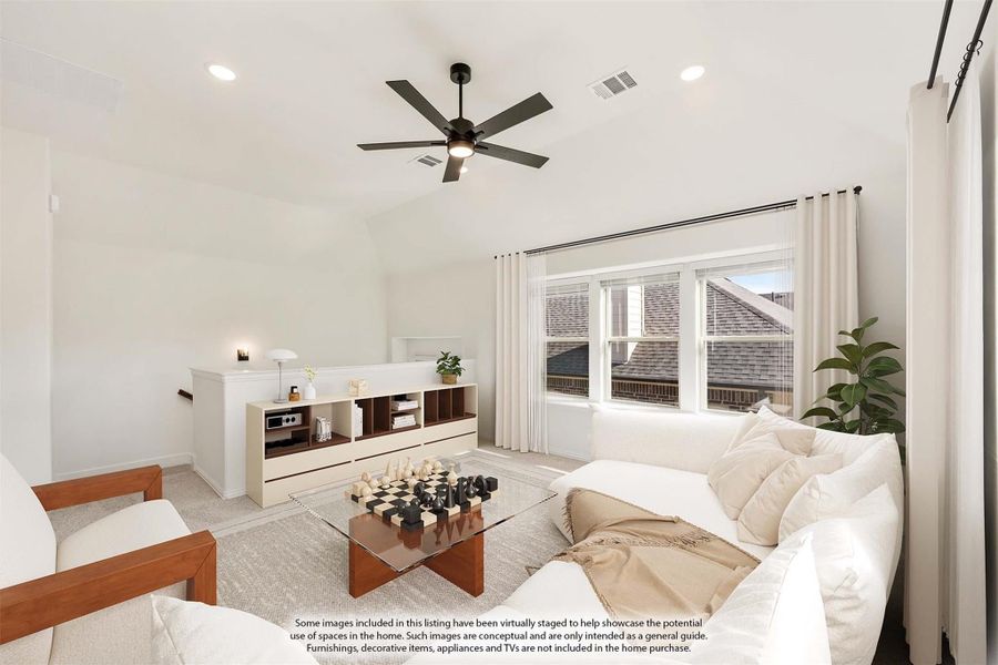Bright living room with vaulted ceiling, ceiling fan, white sofa, and large windows