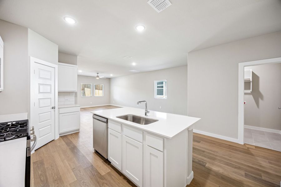 Kitchen in the Willow home plan by Trophy Signature Homes – REPRESENTATIVE PHOTO