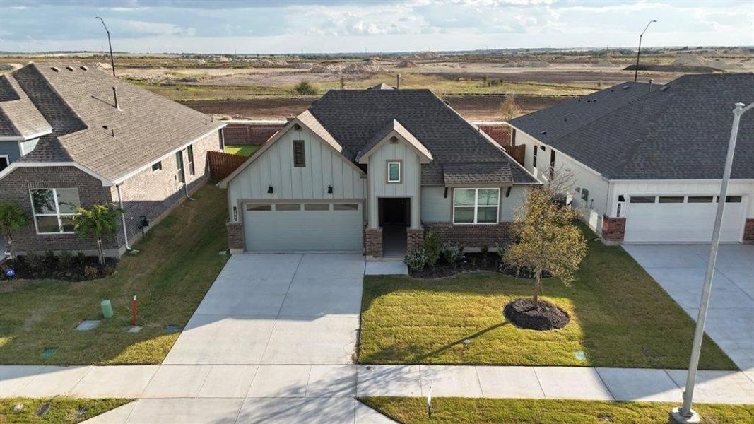 Front exterior of a new home in Rock Creek Ranch, Fort Worth, TX, highlighting curb appeal (Image 2).