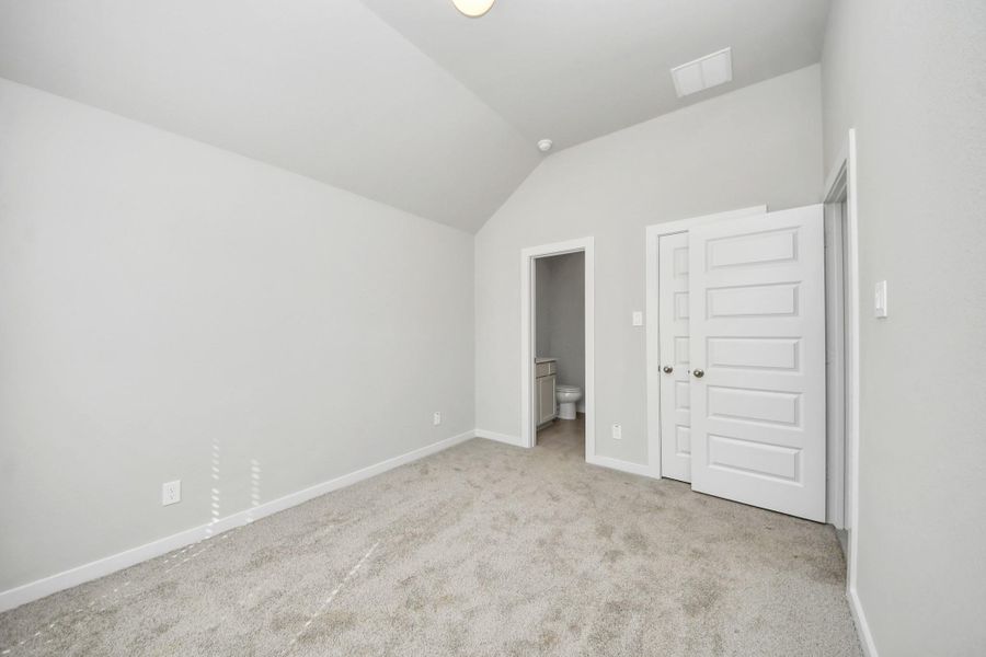Generously sized secondary bedrooms featuring spacious closets, soft and inviting carpeting underfoot, large windows allowing plenty of natural light, and the added touch of privacy blinds for your personal retreat. Sample photo of completed home with similar floor plan. Actual colors and selections may vary.