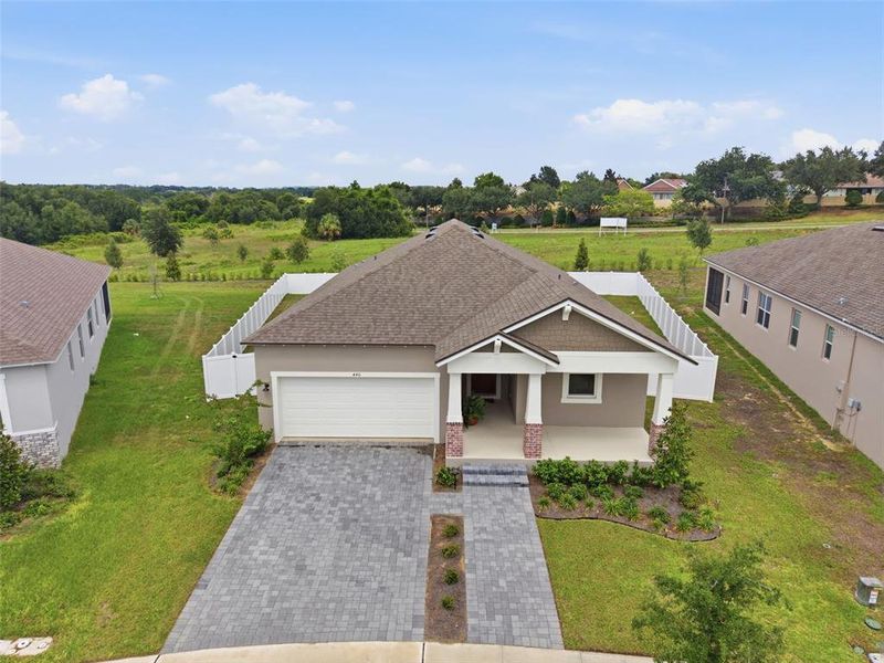 Front exterior of a new home in , Clermont, FL, highlighting curb appeal (Image 23).