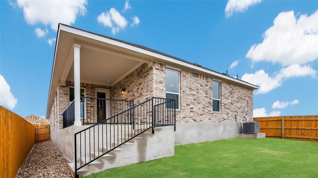 Front exterior of a new home in Rosenbusch Ranch, Leander, TX, highlighting curb appeal (Image 2). Front exterior of a new home in Rosenbusch Ranch, Leander, TX, highlighting curb appeal (Image 2).