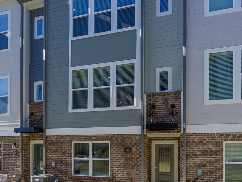 Exterior details and patio area of a home in Central Living at Craig, Charlotte (Image 3).