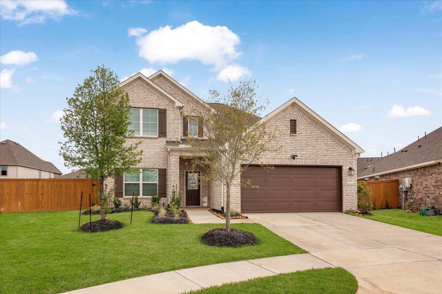 Front exterior of a new home in Marvida, Cypress, TX, highlighting curb appeal (Image 23).