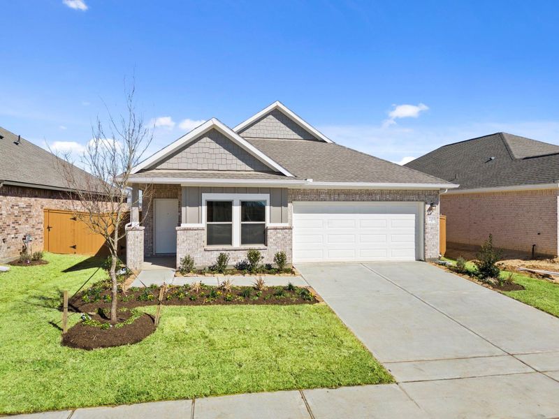 Front exterior of a new home in Cypress Green, Hockley, TX, highlighting curb appeal (Image 23).