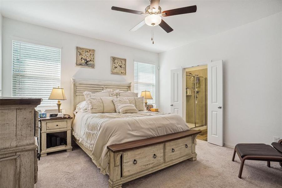 Bedroom featuring ceiling fan and light colored carpet