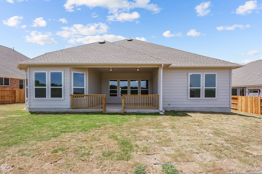 Front exterior of a new home in Homestead, Schertz, TX, highlighting curb appeal (Image 2).