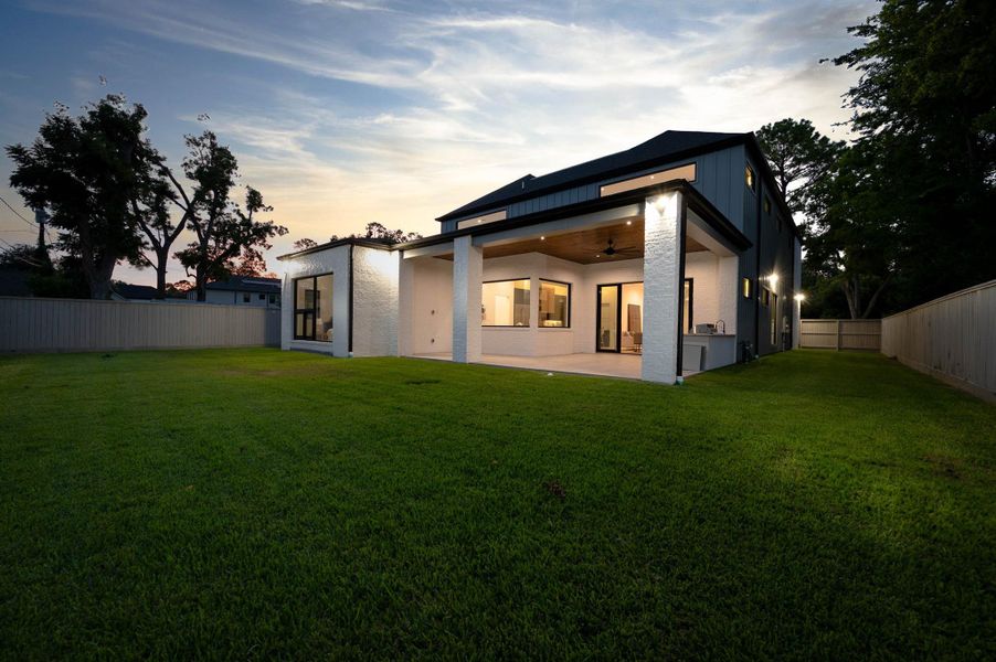 Covered patio with concrete tile flooring, prewired for Cat6, sound, and TV,