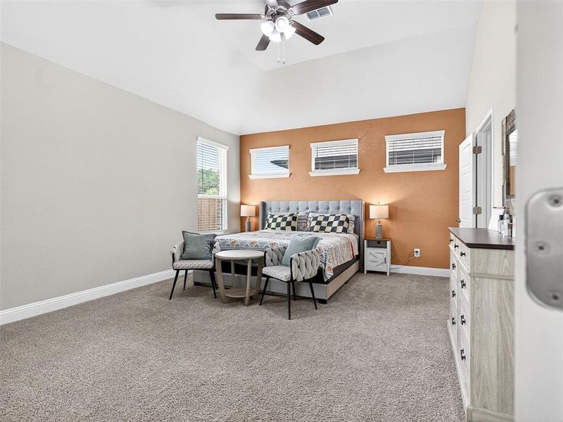 Interior space featuring a vaulted ceiling and a ceiling fan with light fixture Interior space featuring a vaulted ceiling and a ceiling fan with light fixture