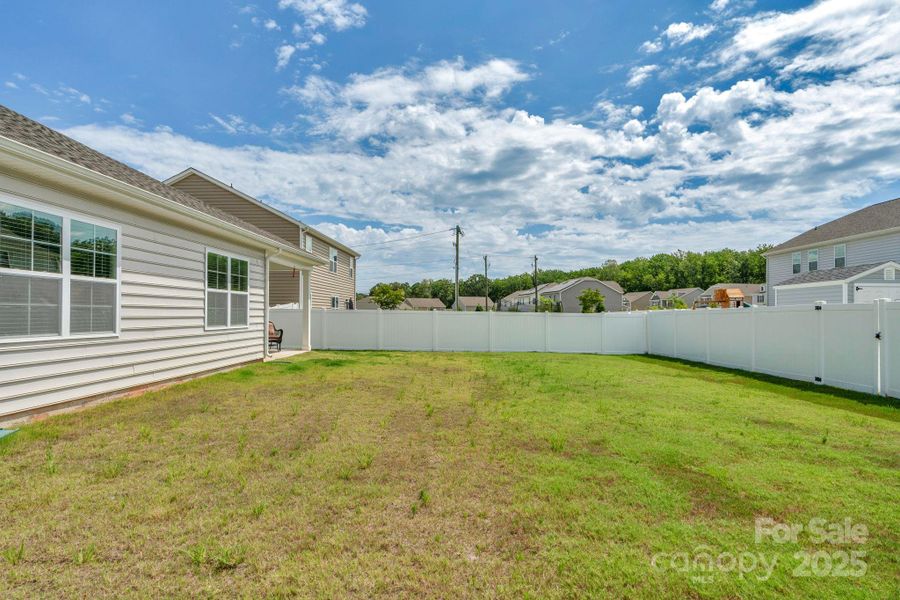 Front exterior of a new home in Crossroads, Locust, NC, highlighting curb appeal (Image 2). Front exterior of a new home in Crossroads, Locust, NC, highlighting curb appeal (Image 2).
