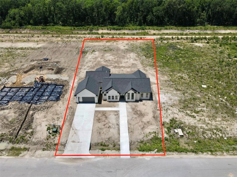 Front exterior of a new home in , Dayton, TX, highlighting curb appeal (Image 2).