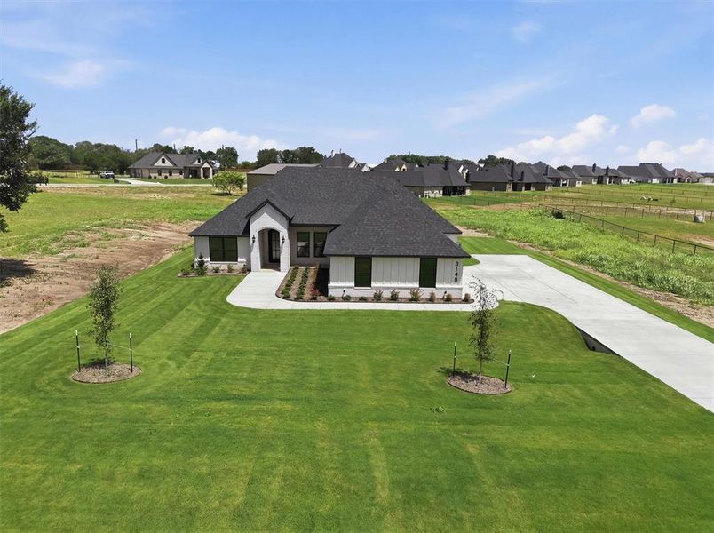 Front exterior of a new home in , Weatherford, TX, highlighting curb appeal (Image 24). Front exterior of a new home in , Weatherford, TX, highlighting curb appeal (Image 24).