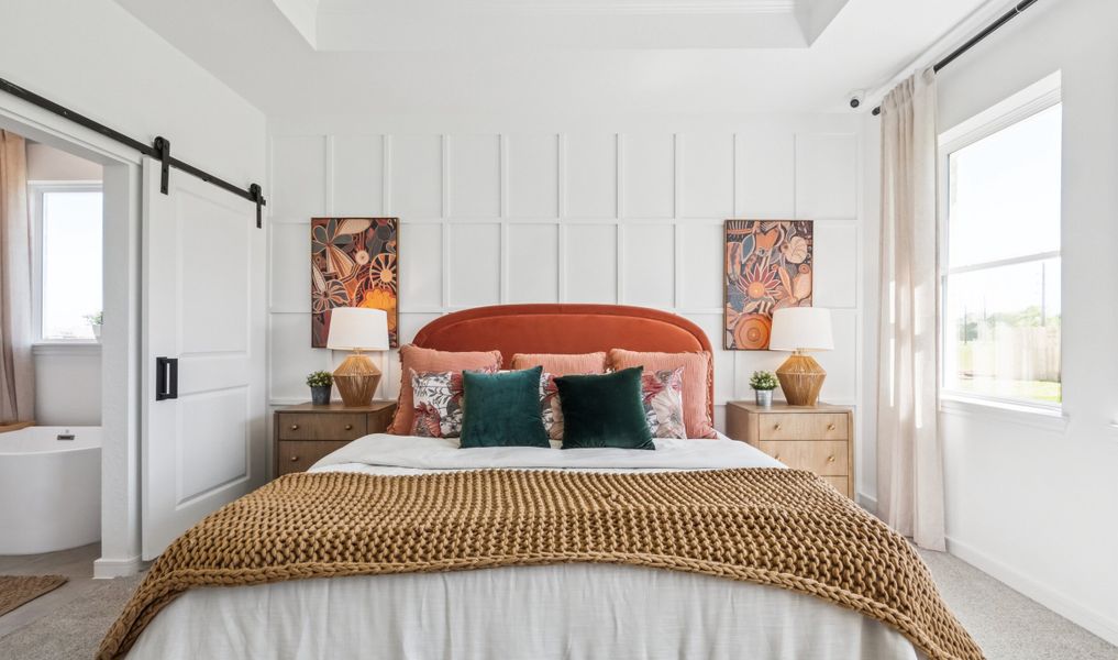 Primary suite with sliding barn door to primary bath Primary suite with sliding barn door to primary bath