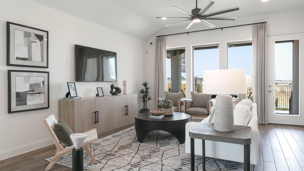 Living area with light wood-style floors, lofted ceiling, a ceiling fan, and recessed lighting