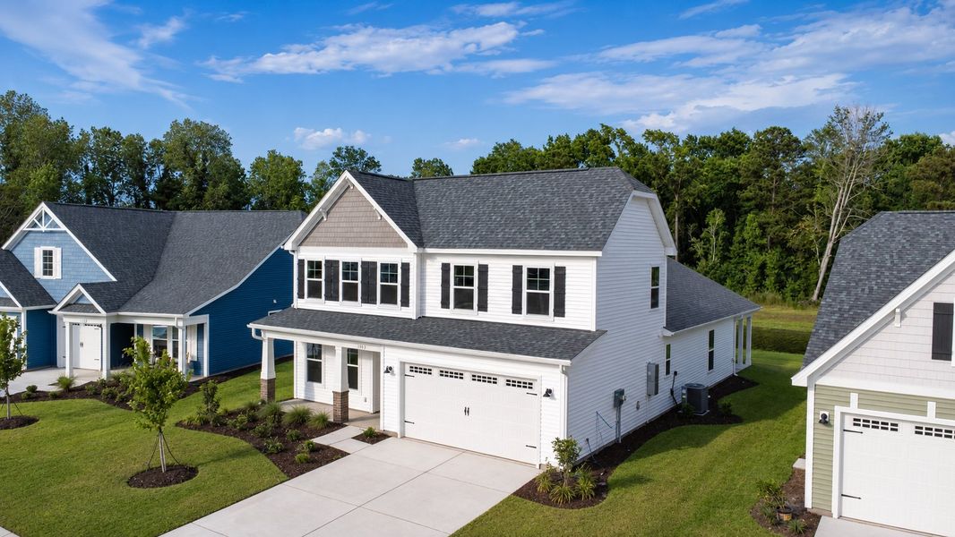 Front exterior of a new home in Traditions at Carolina Forest, Myrtle Beach, SC, highlighting curb appeal (Image 2). Front exterior of a new home in Traditions at Carolina Forest, Myrtle Beach, SC, highlighting curb appeal (Image 2).