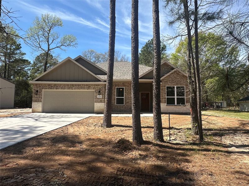Front exterior of a new home in , Montgomery, TX, highlighting curb appeal (Image 1). Front exterior of a new home in , Montgomery, TX, highlighting curb appeal (Image 1).