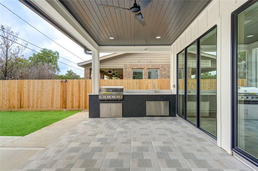 Covered Patio with 5 burner Grill hooked up to Natural Gas line (No propane please) and large sink