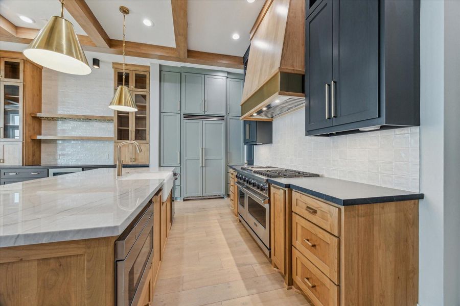 Custom cabinetry with plenty of storage and designer finishes.