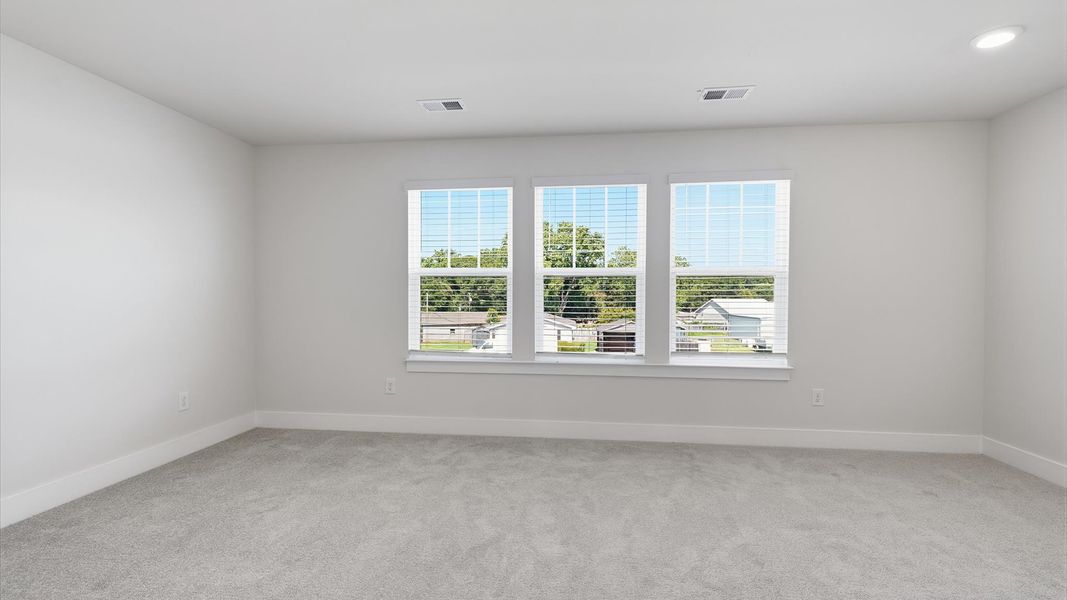 Serene and stylish primary bedroom featuring carpeted flooring and a thoughtful, modern layout at Saluda Crossing Serene and stylish primary bedroom featuring carpeted flooring and a thoughtful, modern layout at Saluda Crossing
