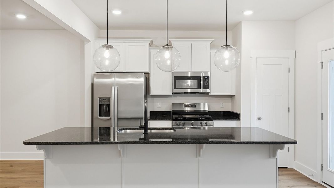 Beautifully appointed kitchen with spacious counters and sophisticated detailing by DRB Homes