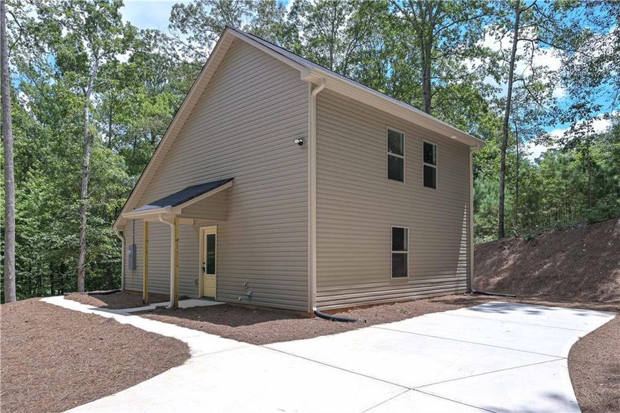 Front exterior of a new home in , Buchanan, GA, highlighting curb appeal (Image 16).