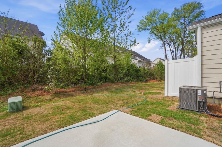 Exterior details and patio area of a home in Harrisburg Village Townhomes, Harrisburg (Image 29).