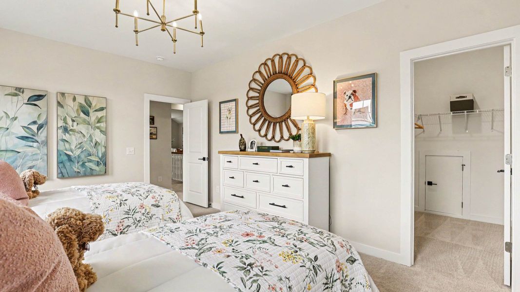 Secondary Bedroom with carpet and windows