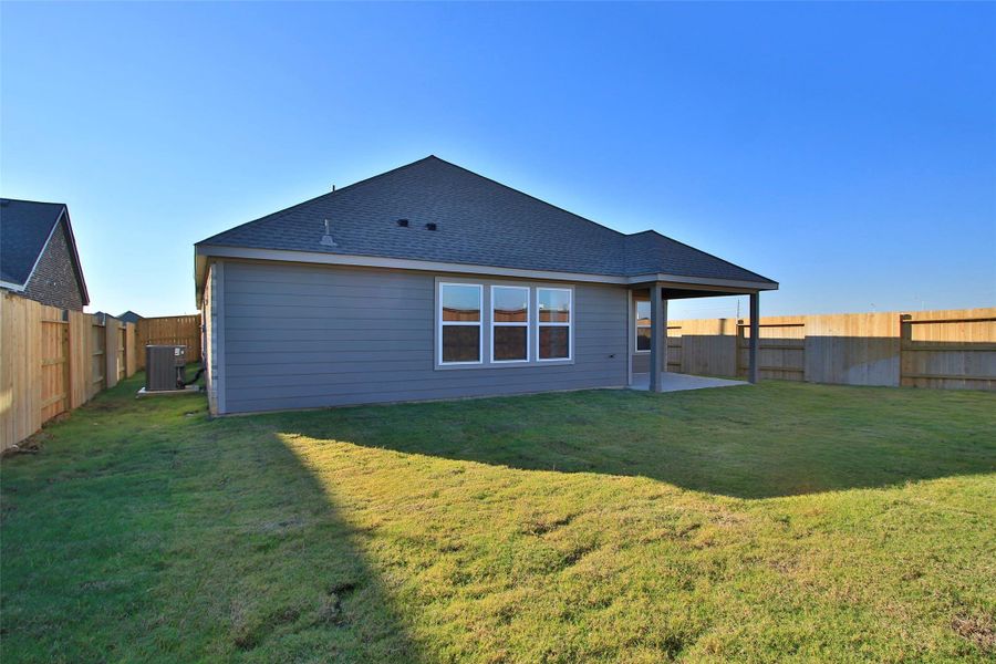 Exterior details and patio area of a home in Oakwood Estates, Waller (Image 2). Exterior details and patio area of a home in Oakwood Estates, Waller (Image 2).