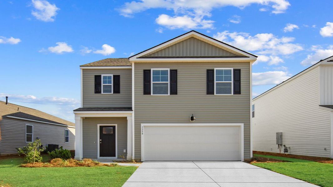 Front exterior of a new home in The Retreat at East Argent, Ridgeland, SC, highlighting curb appeal (Image 1).