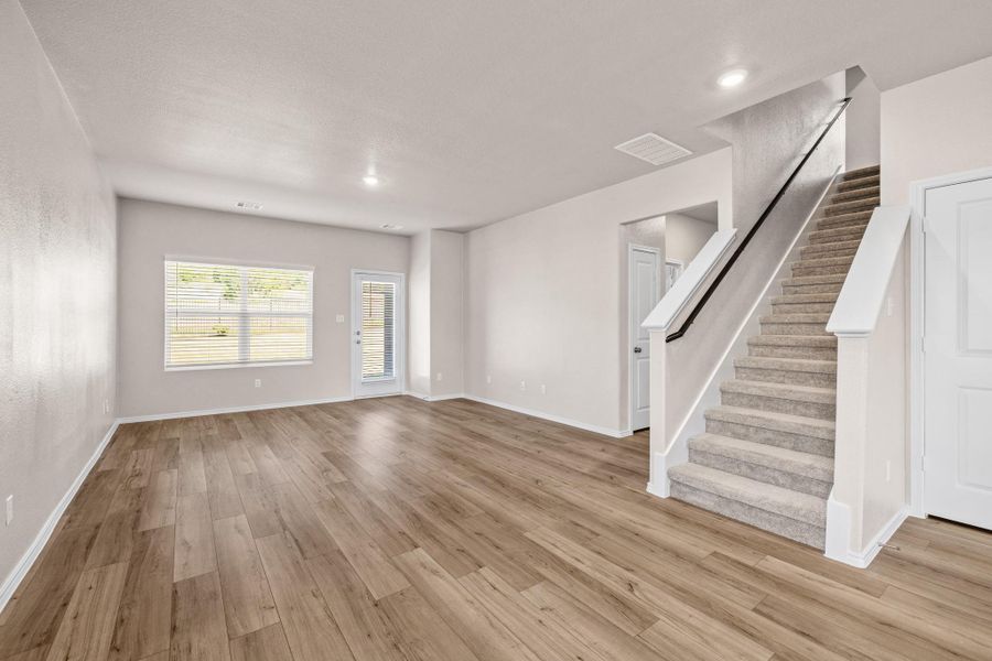 Unfurnished living room featuring light wood-style floors and recessed lighting