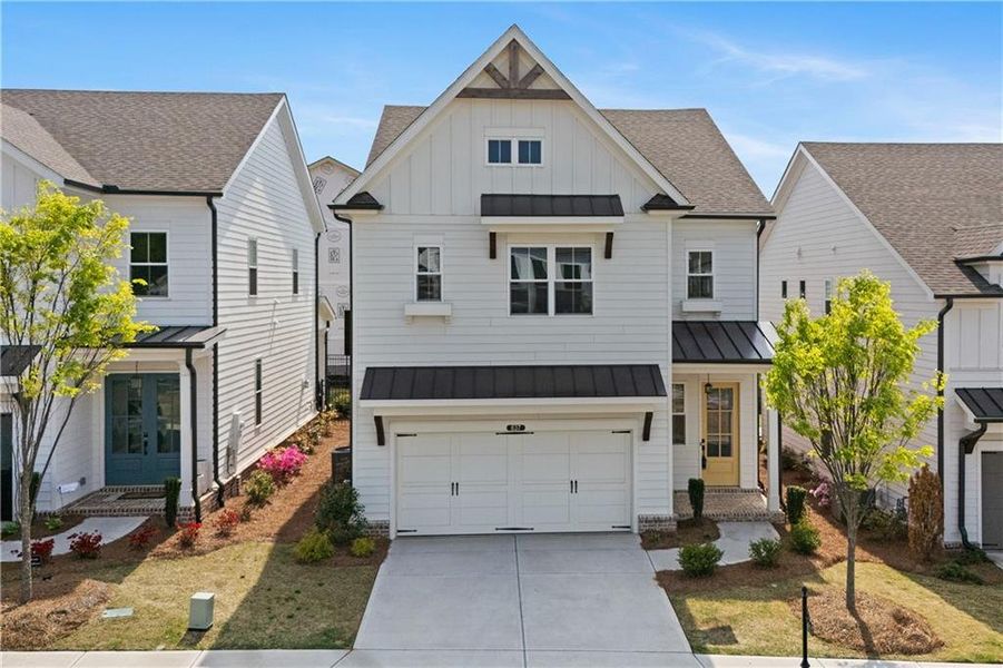Front exterior of a new home in Palisades Single Family, Cumming, GA, highlighting curb appeal (Image 25).