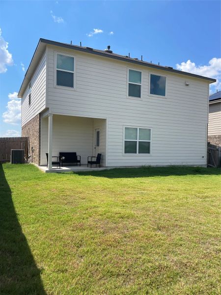 Back of home, covered patio, fenced yard Back of home, covered patio, fenced yard