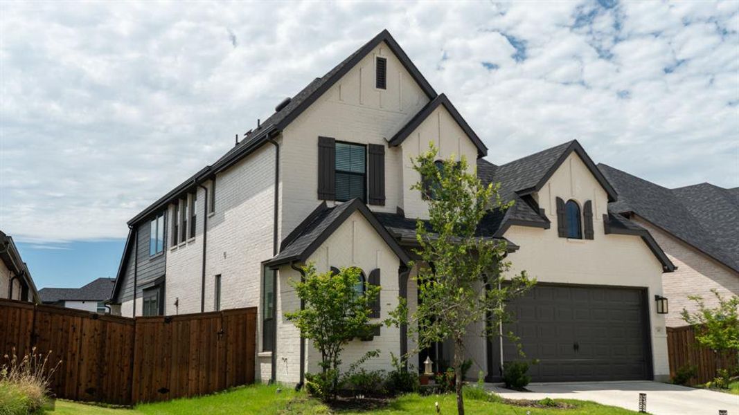Front exterior of a new home in Sandbrock Ranch, Aubrey, TX, highlighting curb appeal (Image 25). Front exterior of a new home in Sandbrock Ranch, Aubrey, TX, highlighting curb appeal (Image 25).