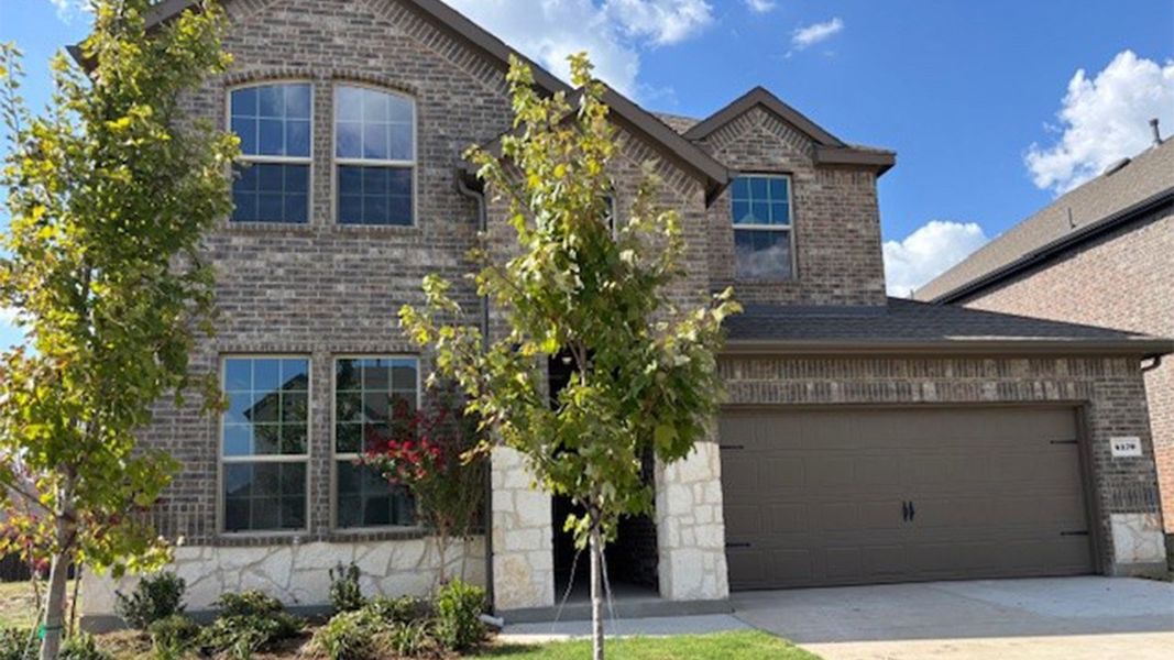 Front exterior of a new home in Lakewood Trails, Forney, TX, highlighting curb appeal (Image 1). Front exterior of a new home in Lakewood Trails, Forney, TX, highlighting curb appeal (Image 1).