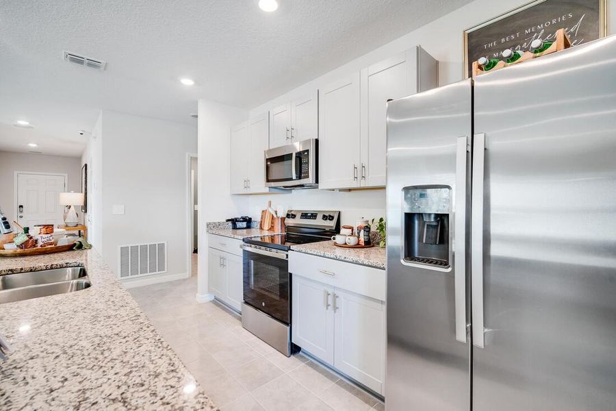 Furnished interior view inside a new home in Waterstone, Groveland (Image 9).