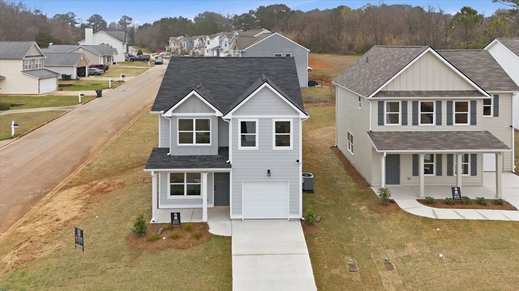 Front exterior of a new home in Creekside Manor, Thomaston, GA, highlighting curb appeal (Image 14).