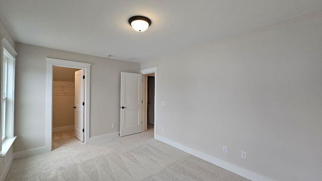 Spacious, unfurnished interior of a new home in The Enclave at French Quarter Creek, Huger (Image 14).