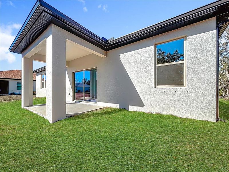 Exterior details and patio area of a home in , North Port (Image 24).