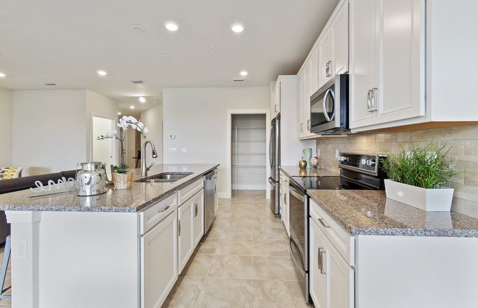 Kitchen with center island and stainless appliances Kitchen with center island and stainless appliances