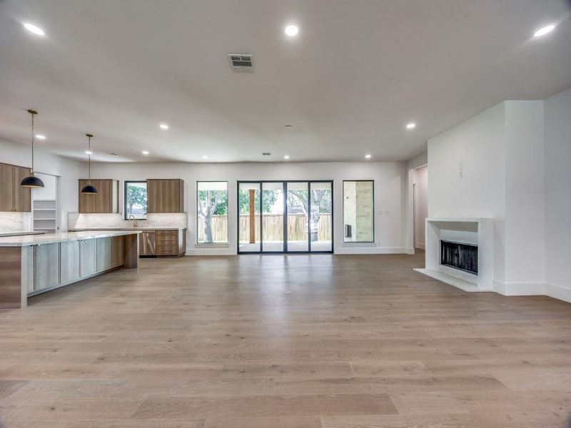 Unfurnished living room with light wood-type flooring